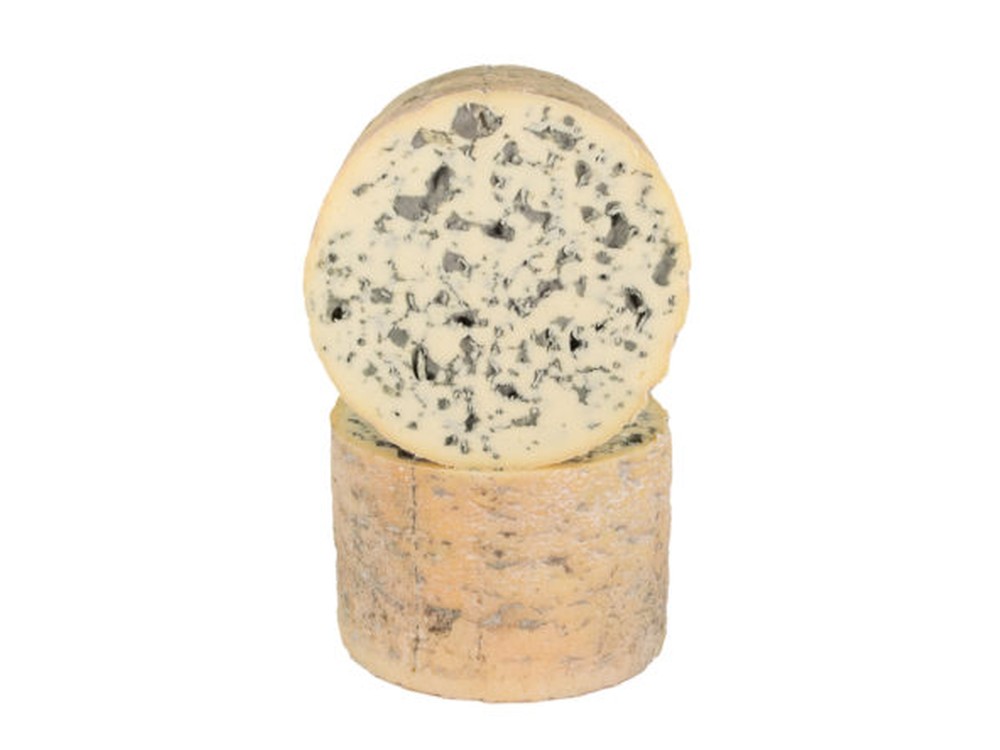 A barrel-shaped Blu del Moncenisio cheese, stacked against a white background, showcasing its dense interior with striking blue veins