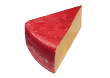 A triangular piece of Hoop Cheese with red rind isolated against a white background.